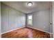 Bright bedroom featuring wood floors and a window at 707 Cool Spring Rd, Statesville, NC 28625