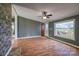 Living room with laminate flooring, gray walls, and a large window at 707 Cool Spring Rd, Statesville, NC 28625