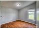 Simple bedroom with wood flooring and a window at 707 Cool Spring Rd, Statesville, NC 28625