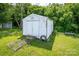 White storage shed with double doors and a ramp, offering extra storage space at 707 Cool Spring Rd, Statesville, NC 28625
