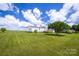 Spacious backyard with a large grassy area, providing ample space for outdoor activities at 707 Cool Spring Rd, Statesville, NC 28625