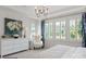 Bright bedroom with white walls, white dresser, and window seating at 3314 Lakeside Dr, Charlotte, NC 28270
