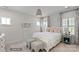 Charming bedroom with white bed and plantation shutters at 3314 Lakeside Dr, Charlotte, NC 28270