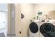 Clean laundry room with stackable washer and dryer at 3314 Lakeside Dr, Charlotte, NC 28270