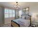 Charming bedroom with a queen-size bed and stylish decor at 3314 Lakeside Dr, Charlotte, NC 28270