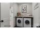 Bright laundry room with side-by-side washer and dryer at 3314 Lakeside Dr, Charlotte, NC 28270