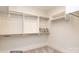 Spacious walk-in closet with custom shelving and hanging rods at 3314 Lakeside Dr, Charlotte, NC 28270