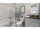 Clean bathroom with a tub, toilet, and modern vanity at 3314 Lakeside Dr, Charlotte, NC 28270
