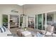 Bright sunroom with sliding glass doors leading to backyard and views of the kitchen and living areas at 3314 Lakeside Dr, Charlotte, NC 28270