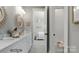 Elegant bathroom with double sinks, marble countertops, and a soaking tub at 3314 Lakeside Dr, Charlotte, NC 28270