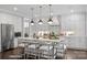 Modern kitchen with white cabinets, island and stainless steel appliances at 3314 Lakeside Dr, Charlotte, NC 28270