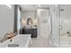 Bathroom with walk-in shower, soaking tub, and patterned tile floor at 3314 Lakeside Dr, Charlotte, NC 28270