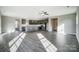 Open concept living room with kitchen views and hardwood floors at 11507 Valley Oaks Ln, Stanfield, NC 28163