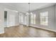 Bright dining room with hardwood floors and chandelier at 11515 Valley Oaks Ln, Stanfield, NC 28163