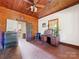 Spacious bedroom with wood floors and ceiling; features a desk and built-in dresser at 10910 Archer Rd, Davidson, NC 28036