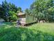 Single-wide mobile home on a grassy lot with trees at 10910 Archer Rd, Davidson, NC 28036