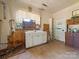 Rustic kitchen features wood cabinets and vintage sink at 10910 Archer Rd, Davidson, NC 28036
