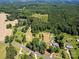 Aerial view of property showing surrounding land and houses at 10910 Archer Rd, Davidson, NC 28036