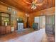 Wood paneled bedroom with built-in shelving and fireplace at 10910 Archer Rd, Davidson, NC 28036