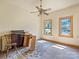 Simple bedroom with hardwood floors and ceiling fan at 10910 Archer Rd, Davidson, NC 28036