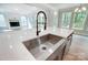 Modern kitchen features a farmhouse sink and a sleek faucet at 2016 Cedar Falls Dr # 7, Waxhaw, NC 28173