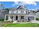 Two-story house with gray siding, a covered porch, and a two-car garage at 2016 Cedar Falls Dr # 7, Waxhaw, NC 28173