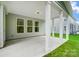 Covered back porch with white columns and access to the house at 2016 Cedar Falls Dr # 7, Waxhaw, NC 28173