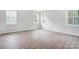 Bedroom with hardwood floors and multiple windows at 2016 Cedar Falls Dr # 7, Waxhaw, NC 28173
