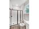 Bathroom with white subway tile shower, glass enclosure, and built-in seat at 2016 Cedar Falls Dr # 7, Waxhaw, NC 28173