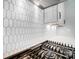 Modern kitchen features white hexagonal backsplash and stainless steel gas cooktop at 2016 Cedar Falls Dr # 7, Waxhaw, NC 28173