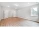 Spacious bedroom with wood-look flooring and double doors leading to another room at 2016 Cedar Falls Dr # 7, Waxhaw, NC 28173
