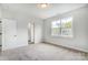 Bright bedroom with neutral carpeting and large window at 2016 Cedar Falls Dr # 7, Waxhaw, NC 28173