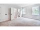 Bedroom with carpet, double doors to closet, and en-suite bathroom at 2016 Cedar Falls Dr # 7, Waxhaw, NC 28173