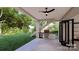 Outdoor kitchen with built-in grill and wine cooler at 14007 Point Lookout Rd, Charlotte, NC 28278