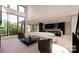 Open concept living room with a modern kitchen and high ceilings at 14007 Point Lookout Rd, Charlotte, NC 28278