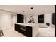 Modern kitchen with marble island, stainless steel appliances, and ample counter space at 14007 Point Lookout Rd, Charlotte, NC 28278