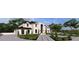 Grand home with a curved driveway, manicured landscaping, and a three-car garage at 14007 Point Lookout Rd, Charlotte, NC 28278