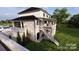 Modern home with attached garage, deck, and landscaping at 14007 Point Lookout Rd, Charlotte, NC 28278