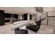Open concept living area with modern curved sofa and kitchen views at 14007 Point Lookout Rd, Charlotte, NC 28278