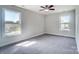 Bedroom with two windows and gray carpeting at 14447 Waterlyn Dr, Charlotte, NC 28278