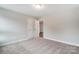 Empty bedroom with carpet and open door at 130 Summerhill Dr # 16, Mooresville, NC 28115