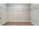 Empty walk-in closet with wire shelving and carpeted floor at 130 Summerhill Dr # 16, Mooresville, NC 28115