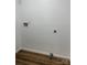 Bright laundry room with washer and dryer hookups and vinyl flooring at 115 Palmer St, Shelby, NC 28150