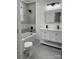 Updated bathroom with double vanity, gray tile, and modern fixtures at 115 Palmer St, Shelby, NC 28150