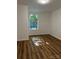 Bright bedroom with hardwood floors and a large window at 115 Palmer St, Shelby, NC 28150