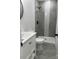 Modern bathroom with a shower, toilet, and white vanity at 115 Palmer St, Shelby, NC 28150