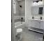 Elegant bathroom with double vanity, bathtub, and gray tile at 115 Palmer St, Shelby, NC 28150