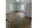 Bright bedroom with two windows and laminate flooring at 115 Palmer St, Shelby, NC 28150
