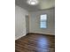 Bright bedroom featuring a large window and vinyl flooring at 115 Palmer St, Shelby, NC 28150