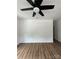 Spacious living room with hardwood floors and ceiling fan at 115 Palmer St, Shelby, NC 28150